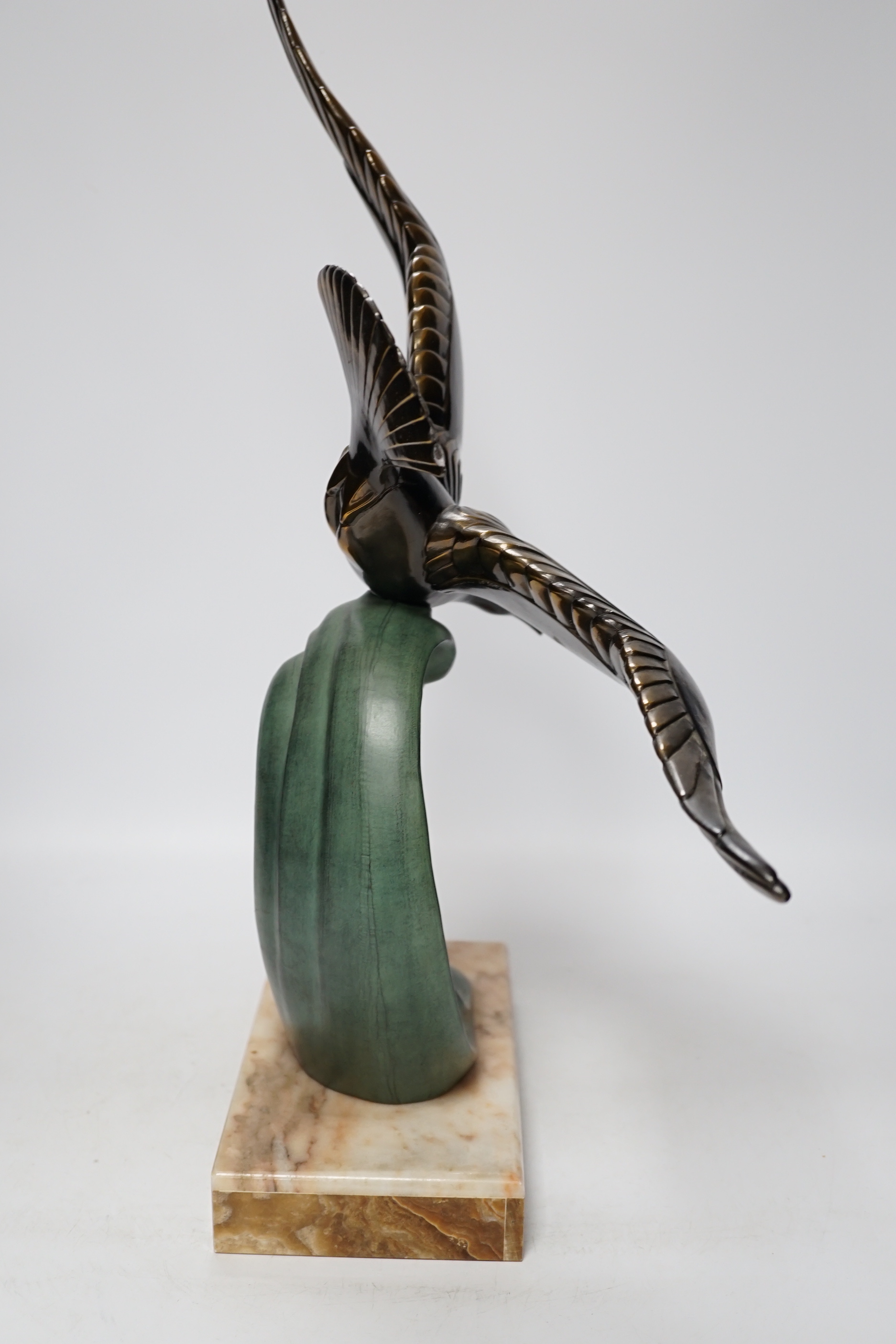 A French Art Deco bronzed and patinated metal Seagull on marble base, 51cm high